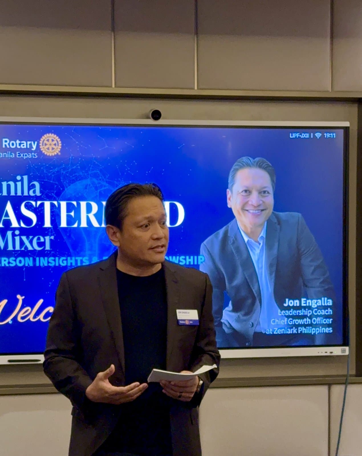 Coach Jon speaking on the Rotary Manila stage